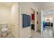 Hallway featuring closet and bathroom with modern finishes and tile flooring at 5450 Barnwood Ct, Pahrump, NV 89061
