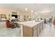 Bright, open kitchen featuring an island with modern countertops and stainless steel sink at 5450 Barnwood Ct, Pahrump, NV 89061