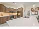 Modern kitchen featuring wood cabinets, stainless steel appliances and a large island with a sink at 5450 Barnwood Ct, Pahrump, NV 89061