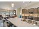 Modern kitchen featuring stone countertops, stainless appliances, and ample cabinet space, perfect for cooking and entertaining at 5450 Barnwood Ct, Pahrump, NV 89061