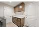 Laundry room featuring modern cabinets and countertops at 5450 Barnwood Ct, Pahrump, NV 89061