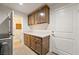 Laundry room featuring modern cabinets, countertop space and lots of light at 5450 Barnwood Ct, Pahrump, NV 89061