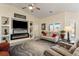 Stylish living room with built-in shelves, modern fireplace, comfortable seating, and natural light for a welcoming ambiance at 5450 Barnwood Ct, Pahrump, NV 89061