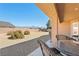 The covered patio provides stunning views of the landscaped backyard and mountains at 5450 Barnwood Ct, Pahrump, NV 89061