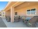 This covered patio includes stylish wicker furniture for outdoor enjoyment at 5450 Barnwood Ct, Pahrump, NV 89061