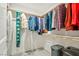 Well-organized walk-in closet with shelving, hanging clothes and space for storage at 5450 Barnwood Ct, Pahrump, NV 89061