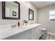 Modern bathroom with double vanity, quartz countertop, and modern fixtures for a sleek design at 5552 Singing Hills Dr, Las Vegas, NV 89130