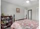 Comfortable bedroom with a full-sized bed, bedside table, and lots of room to store books at 5552 Singing Hills Dr, Las Vegas, NV 89130