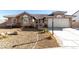 Charming single-story home featuring desert landscaping, tile roof, and attached two-car garage at 5552 Singing Hills Dr, Las Vegas, NV 89130