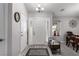 Foyer showcasing a white door with sidelights, light gray walls, and wood-look floors at 5552 Singing Hills Dr, Las Vegas, NV 89130
