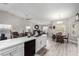 Open kitchen showcasing stainless steel appliances, a breakfast bar, and an adjacent dining area at 5552 Singing Hills Dr, Las Vegas, NV 89130