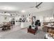 Open-concept living space with dining area, modern kitchen, and comfortable seating at 5552 Singing Hills Dr, Las Vegas, NV 89130