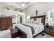 Spacious main bedroom featuring high ceilings, a ceiling fan, and neutral decor at 5552 Singing Hills Dr, Las Vegas, NV 89130