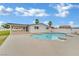 Large in-ground pool with a patio and ample seating area at 7060 S Valley View Blvd, Las Vegas, NV 89118