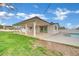 Expansive backyard with a covered patio, offering plenty of space for outdoor activities and entertainment at 7060 S Valley View Blvd, Las Vegas, NV 89118