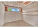 Unfinished basement room showing the concrete walls, window and bare floors at 7060 S Valley View Blvd, Las Vegas, NV 89118