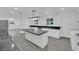 Spacious kitchen with marble countertops, a large island, stainless steel appliances, and recessed lighting at 7060 S Valley View Blvd, Las Vegas, NV 89118