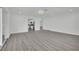 Bright, spacious room with gray floors, neutral paint, recessed lighting, and seamless transition to the rest of the home at 7060 S Valley View Blvd, Las Vegas, NV 89118