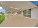 Covered patio featuring a spacious seating area and access to the home through sliding glass doors at 7060 S Valley View Blvd, Las Vegas, NV 89118