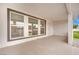 Covered patio area with tile flooring, neutral paint and outdoor access at 7060 S Valley View Blvd, Las Vegas, NV 89118