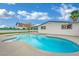 Enjoy the refreshing pool with its tanning ledge and landscaped surroundings, perfect for outdoor relaxation at 7060 S Valley View Blvd, Las Vegas, NV 89118