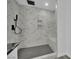 Elegant shower with marble tile, a rainfall shower head, and a convenient built-in bench at 7060 S Valley View Blvd, Las Vegas, NV 89118