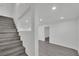 Bright, neutral stairs lead to a spacious area, showcasing the home's modern design and open layout at 7060 S Valley View Blvd, Las Vegas, NV 89118