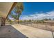 Back porch features decorative iron railing and a view of the surrounding neighborhood at 7079 Laredo St, Las Vegas, NV 89117