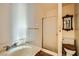 Cozy bathroom featuring a stand-up shower, sink, and toilet at 7079 Laredo St, Las Vegas, NV 89117