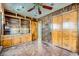Unique bedroom with wood paneling, tile floor, and built in storage at 7079 Laredo St, Las Vegas, NV 89117