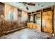 Unique bedroom with wood paneling, tile floor, and built in storage at 7079 Laredo St, Las Vegas, NV 89117