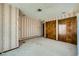 Bedroom featuring striped wallpaper, closet, offering practical storage solutions at 7079 Laredo St, Las Vegas, NV 89117