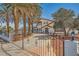 Charming home featuring a two-story design, mature landscaping, and a gated driveway for added privacy at 7079 Laredo St, Las Vegas, NV 89117
