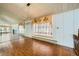 Living room showcasing parquet floors, and window seating with vintage style drapes at 7079 Laredo St, Las Vegas, NV 89117