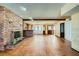 Spacious living room featuring a fireplace, bar area, and an open layout for entertaining at 7079 Laredo St, Las Vegas, NV 89117