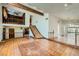 Expansive living room featuring wood floors, staircase, and ample natural light at 7079 Laredo St, Las Vegas, NV 89117