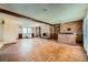 Spacious living room featuring brick fireplace and bar area, offering a cozy and stylish gathering space at 7079 Laredo St, Las Vegas, NV 89117
