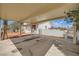Covered patio area with a view of the house and surrounding outdoor space, offering shade and comfort at 7079 Laredo St, Las Vegas, NV 89117