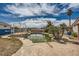Backyard pool area featuring an in-ground pool and a white gazebo, perfect for outdoor relaxation at 7079 Laredo St, Las Vegas, NV 89117