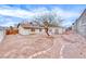 Large backyard featuring mature tree, shed, terraced retaining wall at 720 Scottsdale St, Henderson, NV 89002