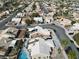 Expansive aerial view of a residential neighborhood featuring single-Gathering homes, swimming pools, and tree-lined streets at 7621 Gosport Ave, Las Vegas, NV 89131