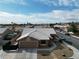 Aerial view of home with well-maintained landscaping, a two-car garage, and a tiled roof at 7621 Gosport Ave, Las Vegas, NV 89131