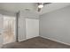 Bedroom featuring gray walls, carpet, a ceiling fan with light, and a closet with sliding doors at 7621 Gosport Ave, Las Vegas, NV 89131