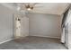 Bedroom featuring a carpet, sliding glass door, a ceiling fan and access to a bathroom at 7621 Gosport Ave, Las Vegas, NV 89131
