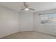 Bedroom featuring carpet, gray walls, a ceiling fan, and a window with blinds at 7621 Gosport Ave, Las Vegas, NV 89131