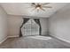 Bedroom featuring a sliding glass door with curtains, carpet, and a ceiling fan at 7621 Gosport Ave, Las Vegas, NV 89131