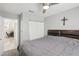 Bedroom featuring an open doorway to another room, a ceiling fan, and a double door closet at 7621 Gosport Ave, Las Vegas, NV 89131