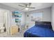 A fully furnished bedroom with ample storage, a TV, and a ceiling fan at 7621 Gosport Ave, Las Vegas, NV 89131