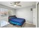 A functional bedroom featuring a ceiling fan, and a desk for work or study at 7621 Gosport Ave, Las Vegas, NV 89131