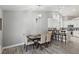 Open dining area with pendant lighting and kitchen bar seating at 7621 Gosport Ave, Las Vegas, NV 89131